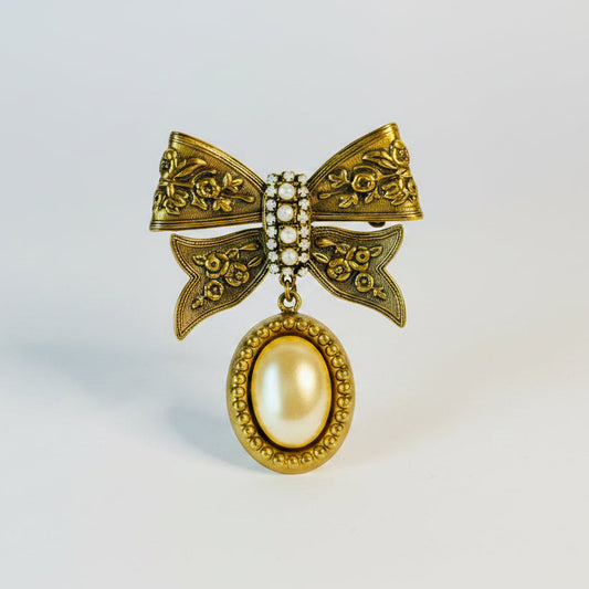 Prendedor lazo dorado con perla | Broche vintage elegante