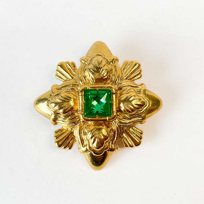 Prendedor vintage Monet dorado con cristal verde facetado de colección