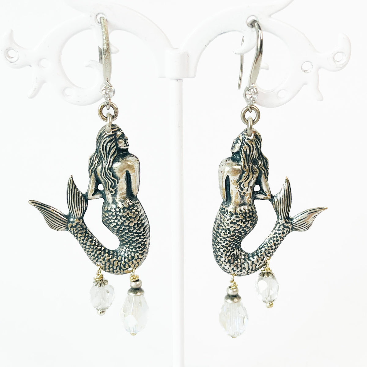 aros sirena plateada elegantes