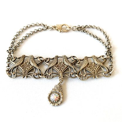 Pulsera plateada con pajaritos besandose